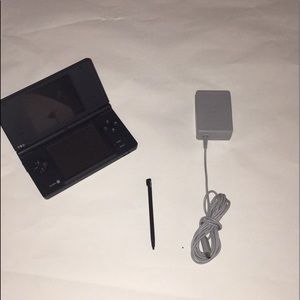 A Nintendo Dsi With The Stylus And Charger